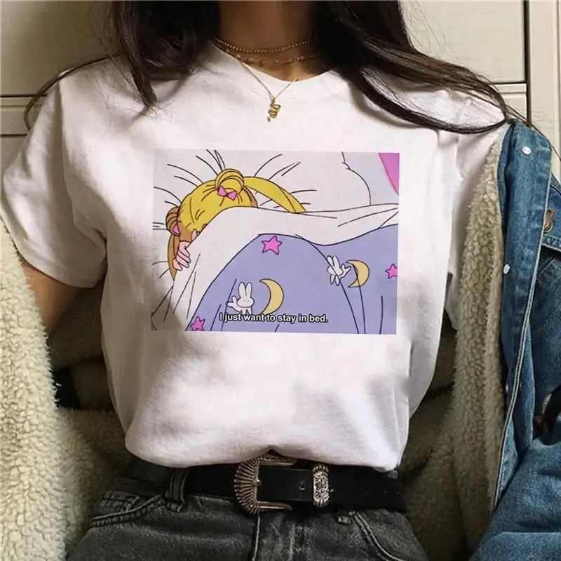 White cotton short sleeve graphic tee featuring sailor moon sleeping under blankets with stars and moons text design