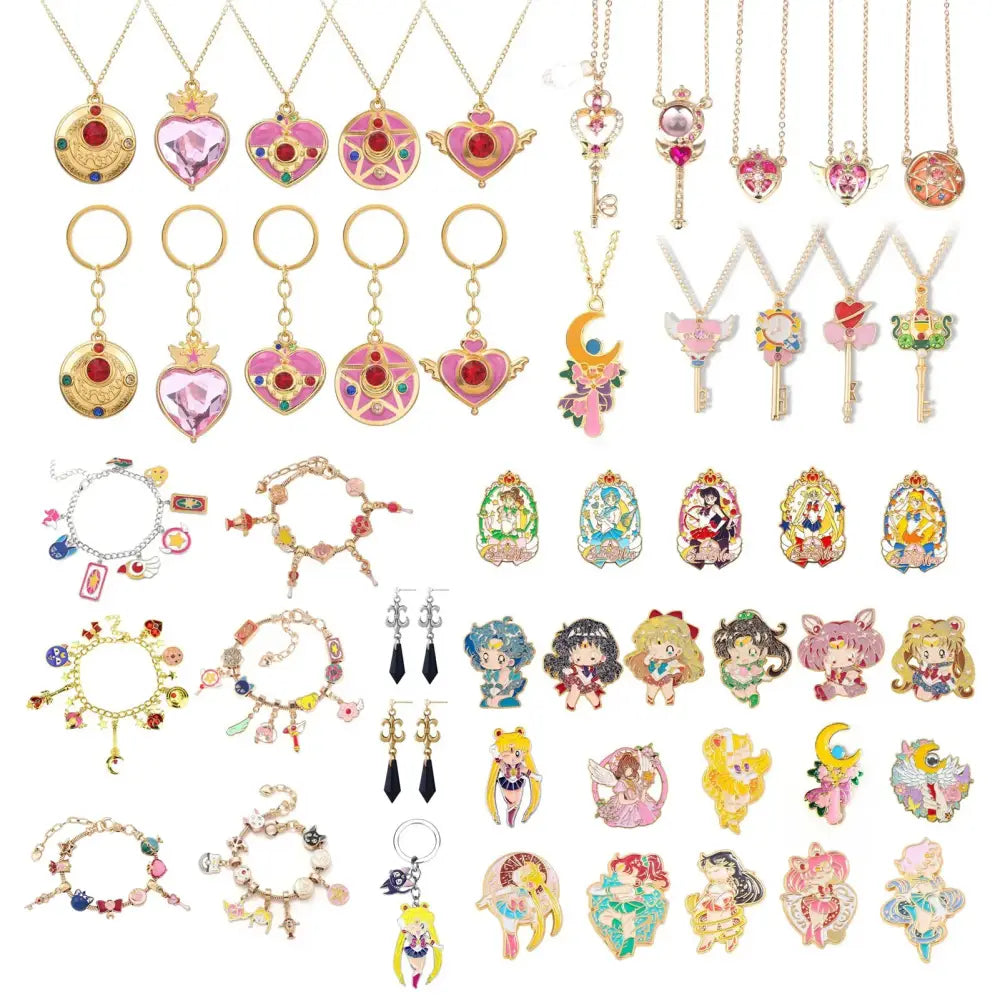A colorful sailor moon usagi enamel keychain with gold chains pink hearts crescent moons and character designs