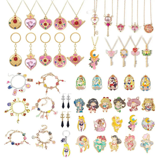 A colorful sailor moon usagi enamel keychain with gold chains pink hearts crescent moons and character designs