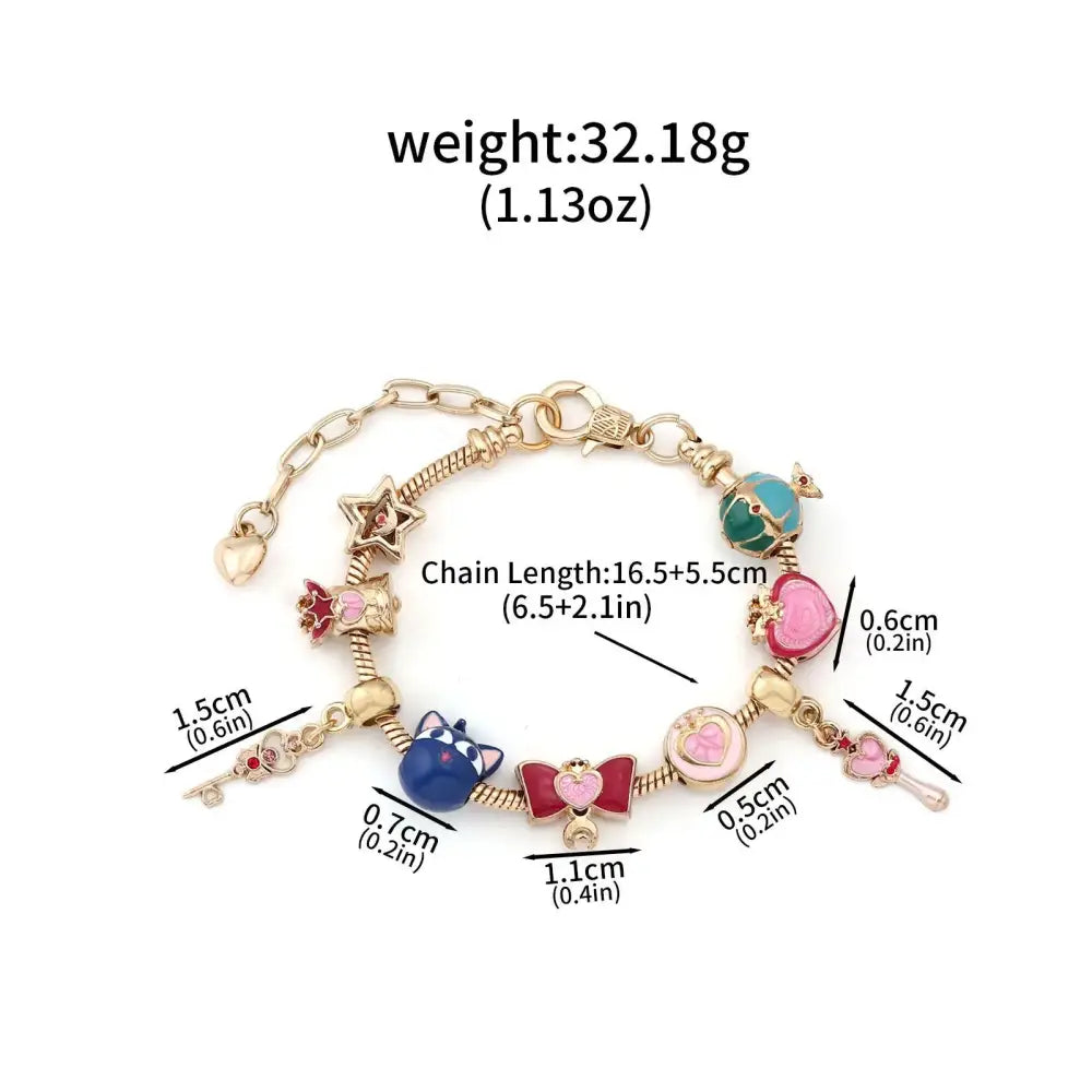 Gold-toned enamel keychain bracelet with colorful charms including blue cat pink bow and green gemstone for cosplay jewelry