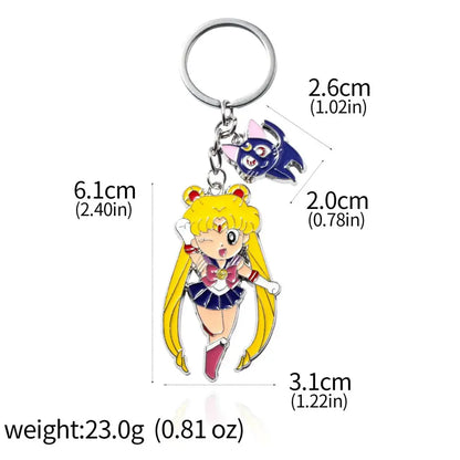 Shiny enamel keychain featuring chibi sailor moon in blue uniform with red bow and luna cat for cosplay jewelry