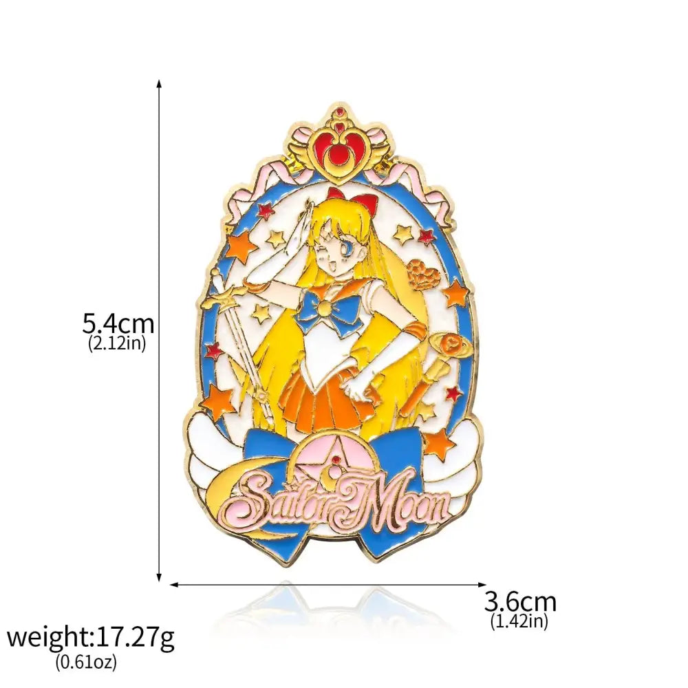A vibrant sailor moon usagi enamel keychain in yellow and orange fuku with stars in a blue and gold brooch pin frame