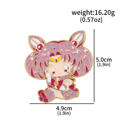 A sparkling pink and gold chibi sailor moon usagi enamel keychain with glittery hair and red eyes cosplay jewelry