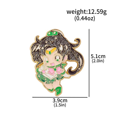 A sparkling green and pink enamel keychain featuring chibi sailor moon usagi with black glitter hair and gold accents