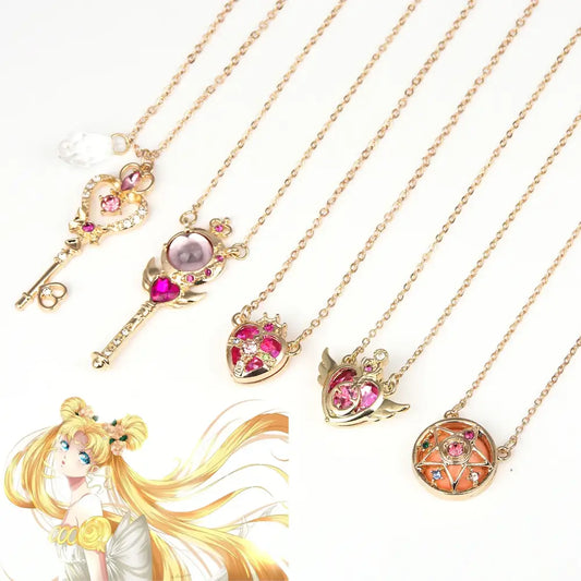 Gold-toned sailor moon tsukino necklace set with key and heart pendants featuring pink gemstones and crystals