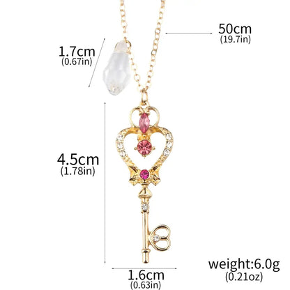 Gold-colored key-shaped pendant necklace with pink and clear gemstones heart design from sailor moon tsukino necklace set