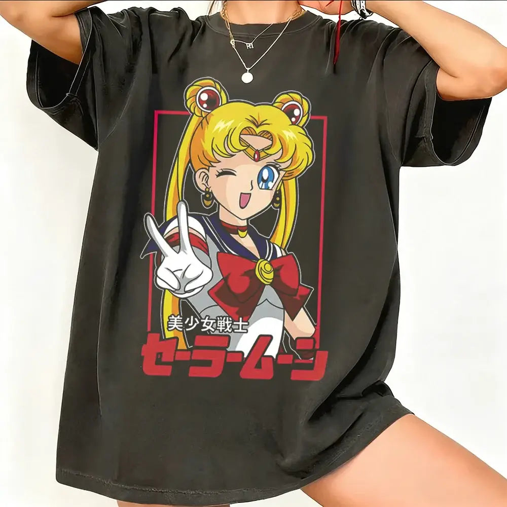 Black oversized sailor moon graphic t-shirt featuring breathable cotton short sleeve with vibrant peace sign design and japanese text
