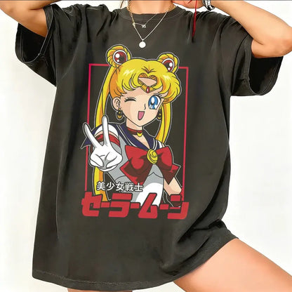 Black oversized sailor moon graphic t-shirt featuring breathable cotton short sleeve with vibrant peace sign design and japanese text