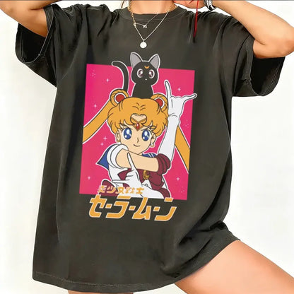 Black oversized sailor moon short sleeve t-shirt with vibrant pink graphic on breathable cotton fabric