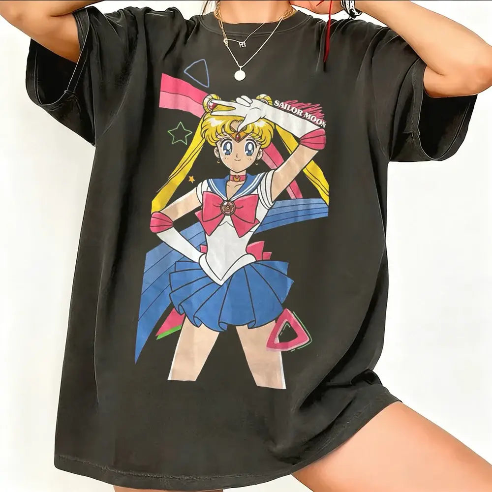 Black breathable cotton short sleeve t-shirt featuring a vibrant sailor moon graphic with pink blue and yellow accents