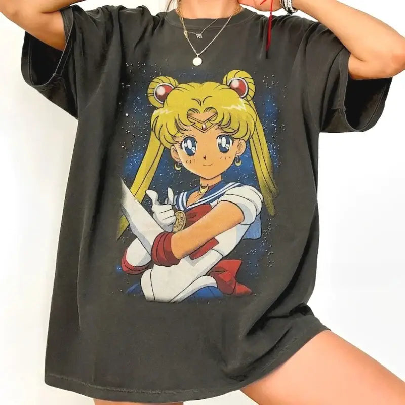 Black oversized cotton short sleeve t-shirt with vibrant sailor moon anime graphic against starry night sky background