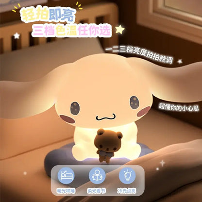 Soft plush white cinnamoroll shaped led atmosphere lamp with warm glow holding small teddy bear figure on lap