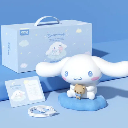 White cinnamoroll plush figurine with pink cheeks and blue eyes holding teddy bear on cloud base atmosphere lamp