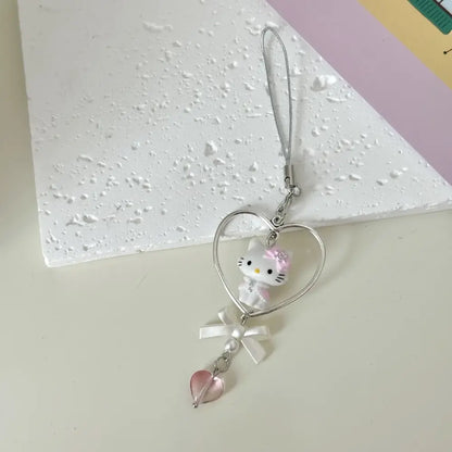 Sanrio hello kitty acrylic phone chain keychain with silver heart charm, white hello kitty, pink bow, and pearl detail