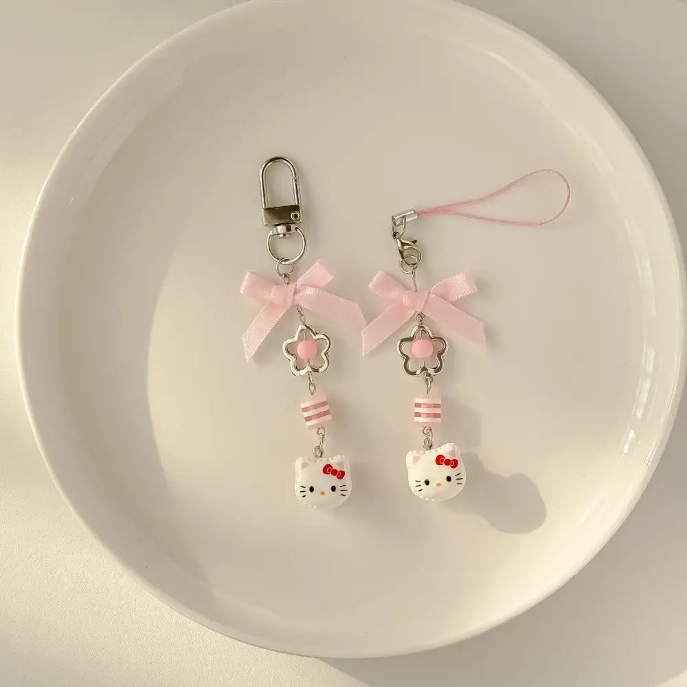 Sanrio hello kitty acrylic phone chain keychain with pink ribbon tie silver clasp and dangling pink bead
