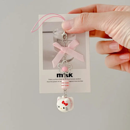 Sanrio Hello Kitty acrylic phone chain keychain in pink and white with silver clasp, ribbon bow, and flower bead