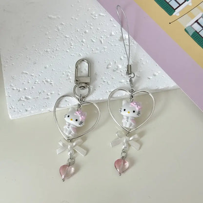 Sanrio hello kitty acrylic phone chain keychain with pink and white heart charm silver frame pearl bow and pink crystal pendant