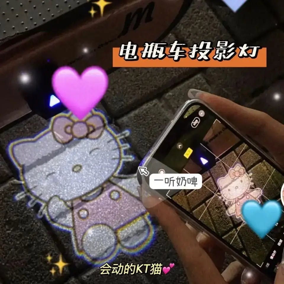 A glittery silver sanrio hello kitty scooter light projecting a sparkling holographic kitty scooter image on a dark surface