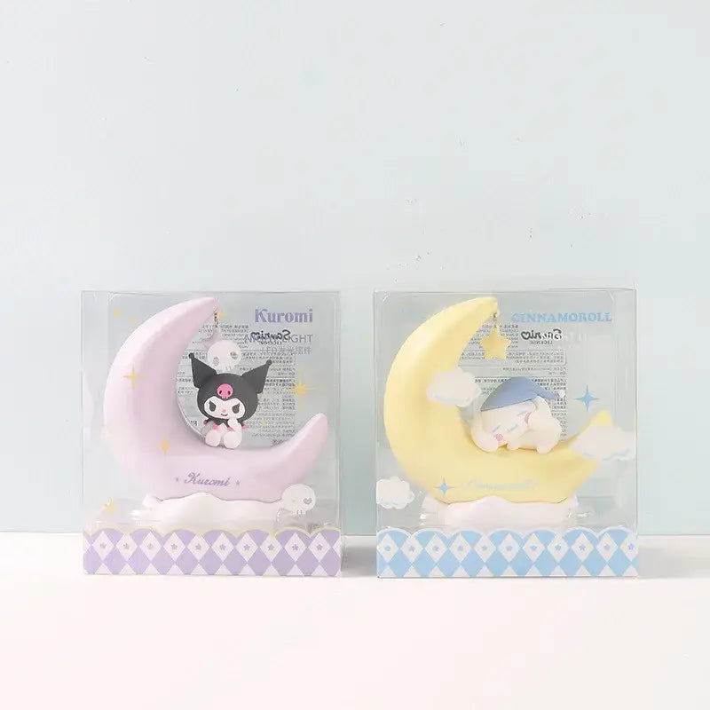 Two pastel crescent led night light keychains featuring pink kuromi and yellow cinnamoroll designs by sanrio