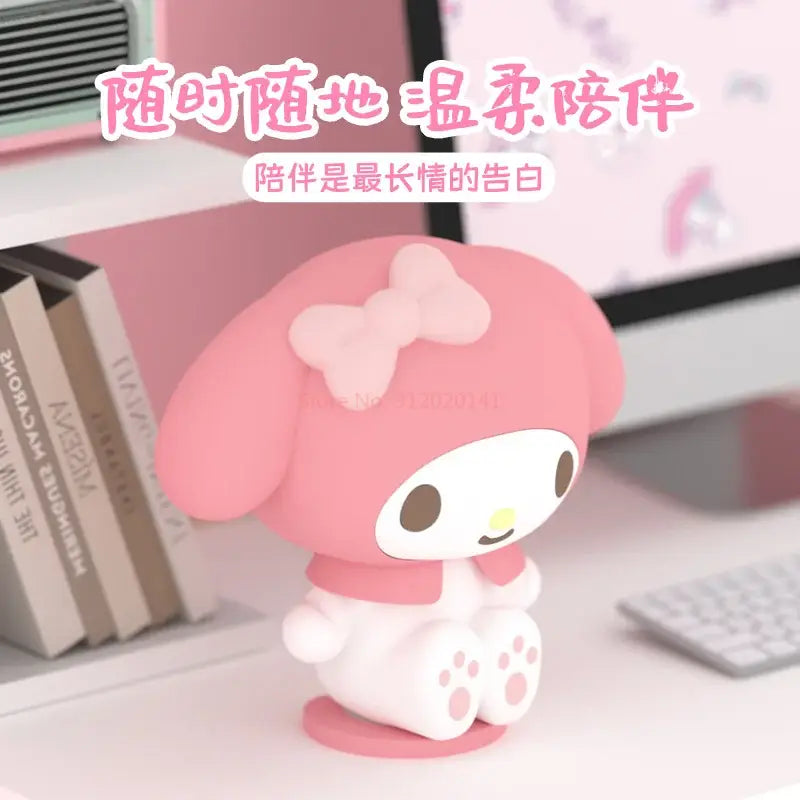 Pink sanrio my melody clap night light figurine with soft plush texture and white face and paw accents silicone lamp