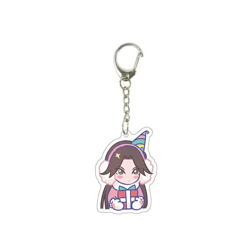 Colorful killer seven acrylic keychain featuring a chibi anime girl with earmuffs and a party hat holding a gift
