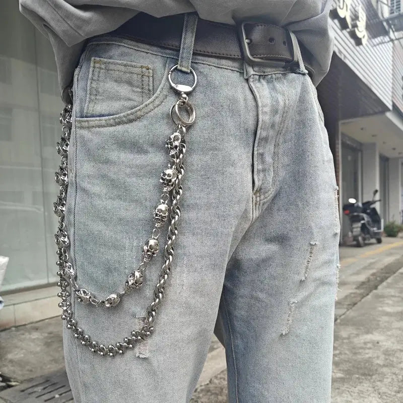 Silver stainless steel skull punk biker pants chain with interlocking links and dangling skulls accessory