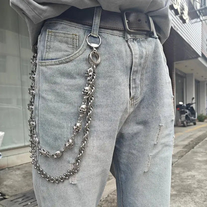 Silver stainless steel skull punk biker pants chain with interlocking links and dangling skulls accessory