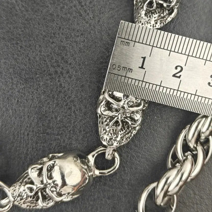 Silver skull-themed stainless steel pants chain with textured skulls and braided link design for punk biker style