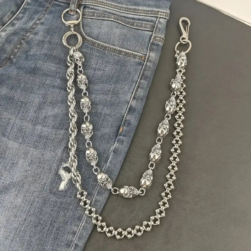 Silver stainless steel pants chain with skull engravings, twisted rope links, and spherical beads for punk biker style