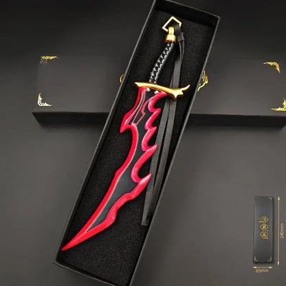 Red and black flame-patterned killer fangs sword with gold accents in a sleek black box 22cm metal keychain