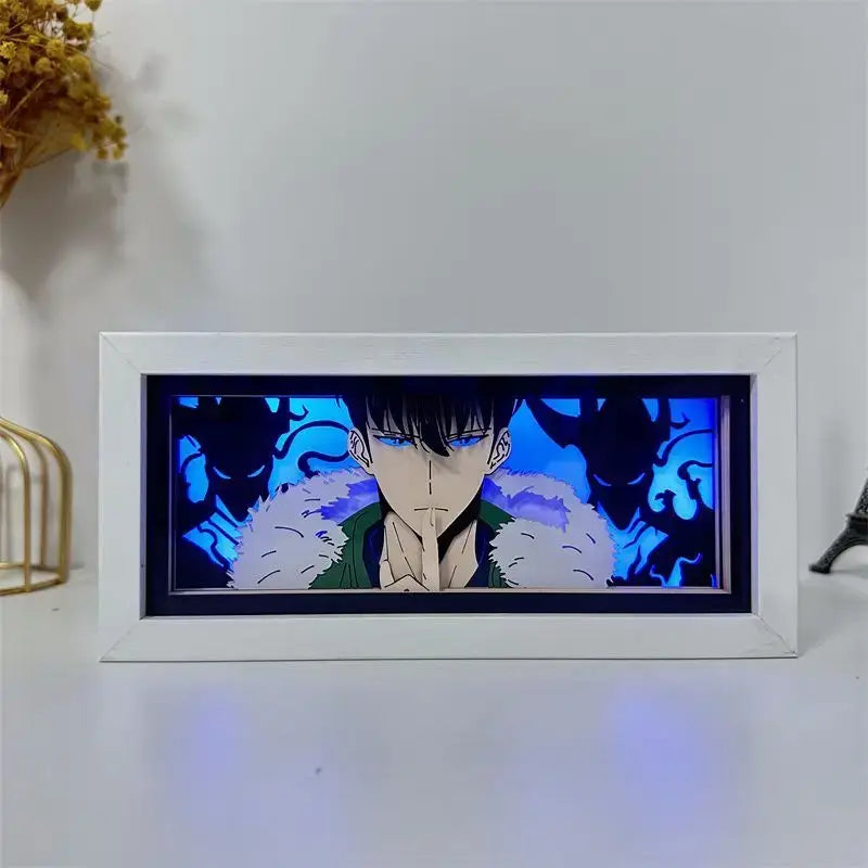 Solo leveling shadow box led lamp featuring a white wood frame and illuminated anime character with blue eyes and black hair