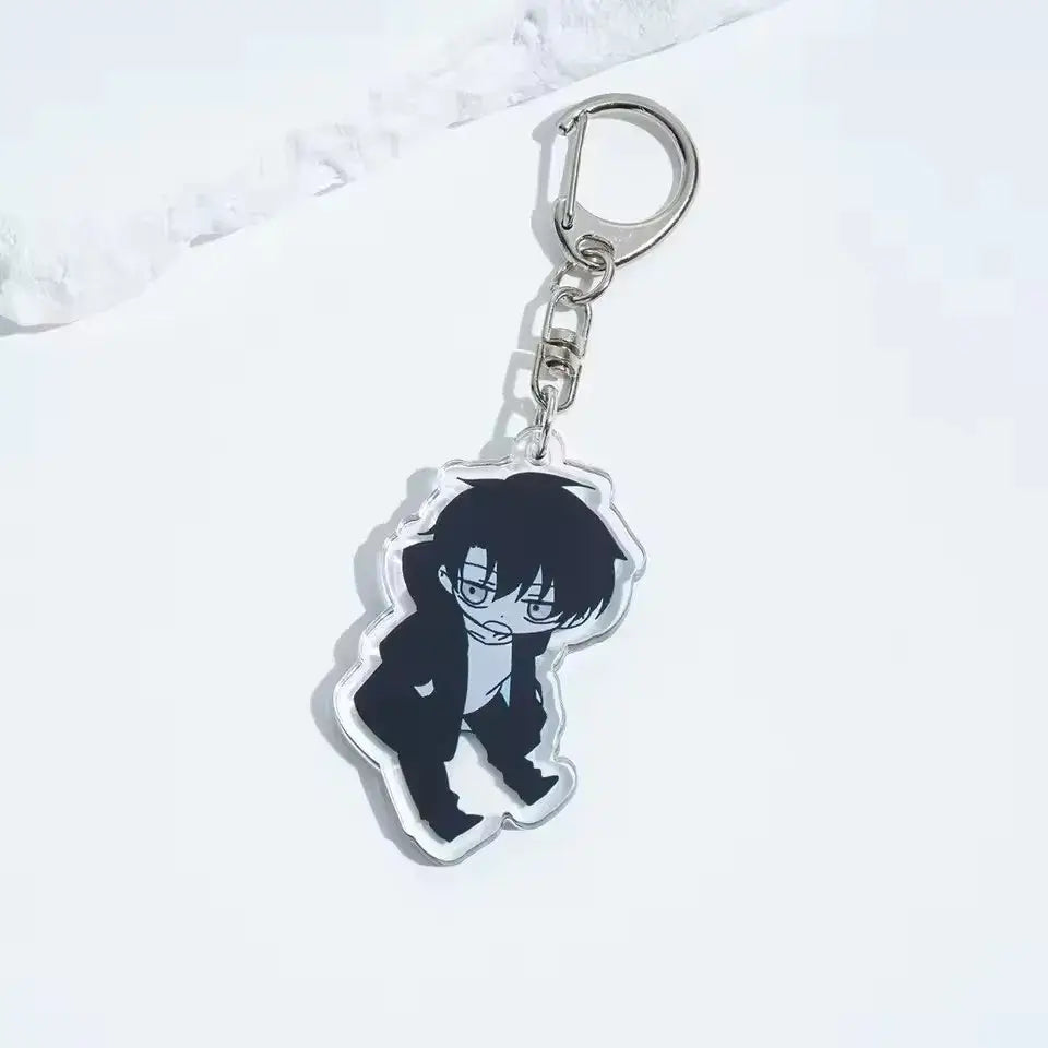 Clear acrylic solo leveling sung jin-woo keychain featuring black-haired anime character in suit with glasses and silver clasp