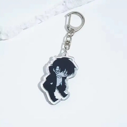 Clear acrylic solo leveling sung jin-woo keychain featuring black-haired anime character in suit with glasses and silver clasp