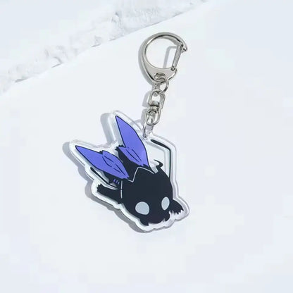 Solo leveling sung jin-woo acrylic keychain in black and purple featuring a cartoon winged creature with silver clip
