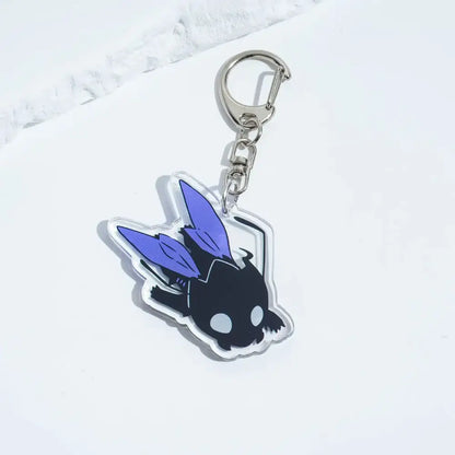 Solo leveling sung jin-woo acrylic keychain in black and purple with a stylized winged creature and white eyes bag pendant