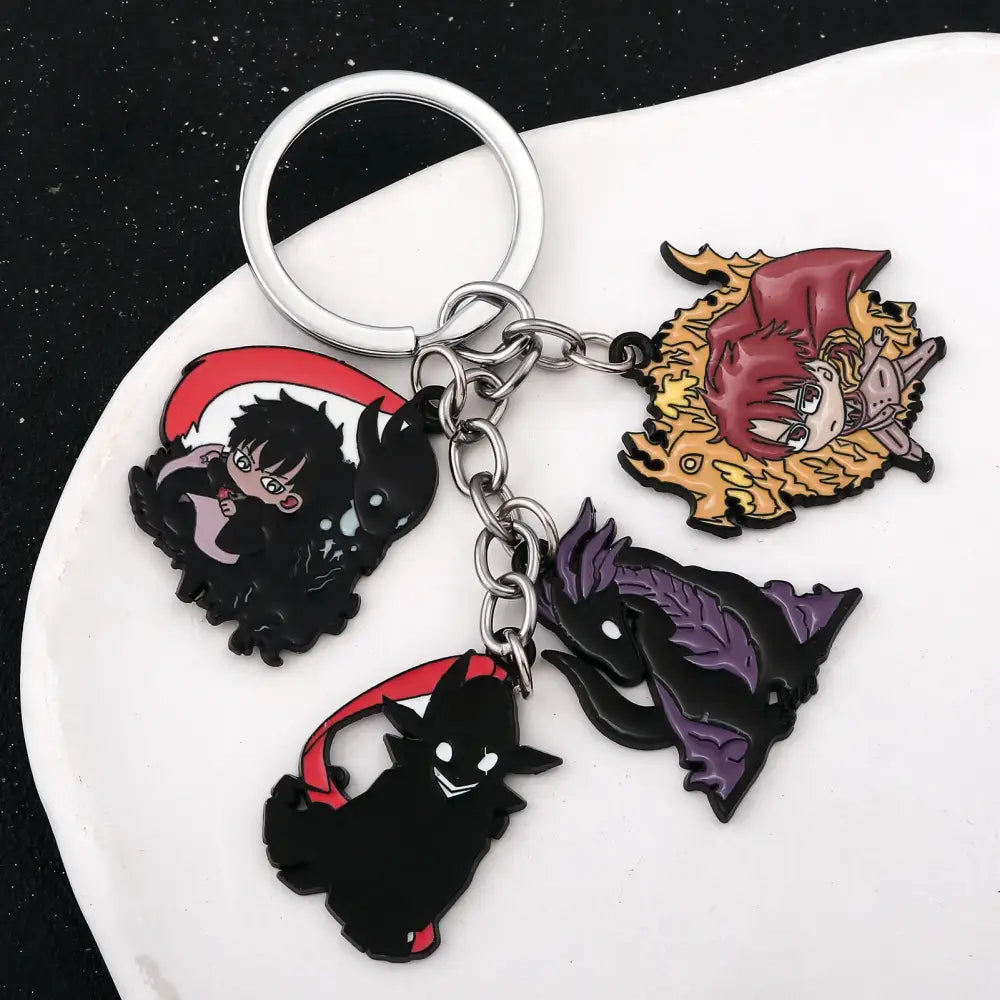 Silver keychain pendant featuring four colorful enamel anime charms from solo leveling sung jin woo short blade design