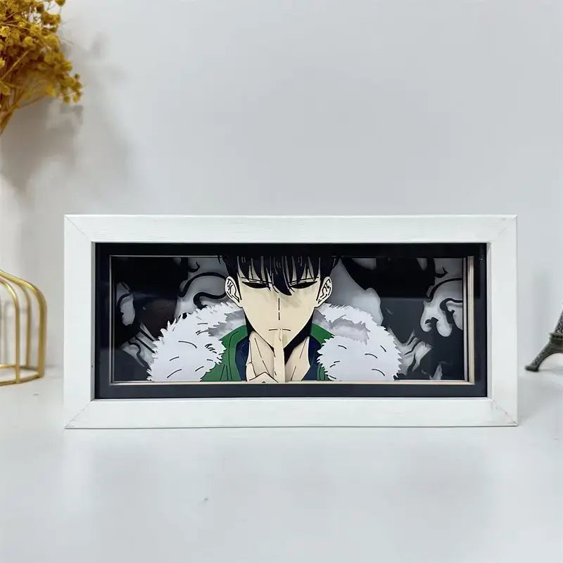 White framed solo leveling sung jin-woo paper cut shadow box led lamp with green figure and white fur trim on dark background