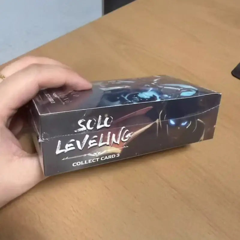 Black rectangular box of solo leveling sung jinwoo collect cards vol 3 korean version with glowing blue eyes design