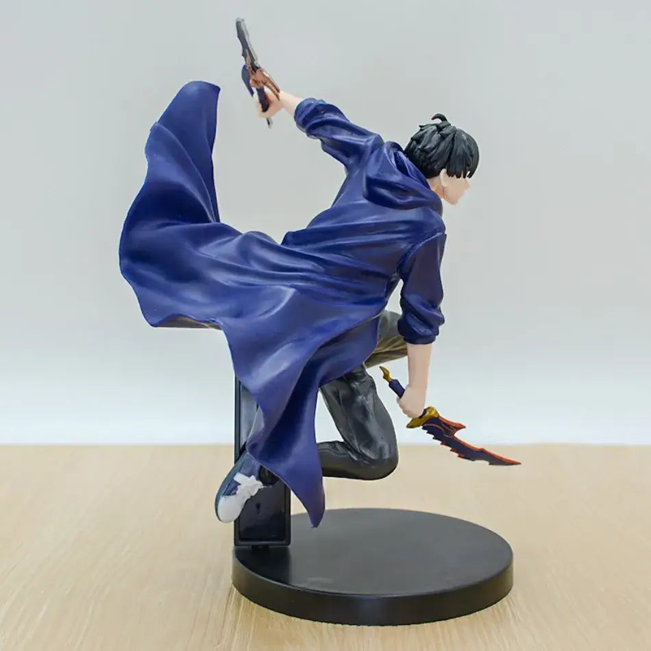A dynamic blue cape-draped solo leveling sung jinwoo pvc figure mid-leap wielding a pistol and ornate red-accented blade
