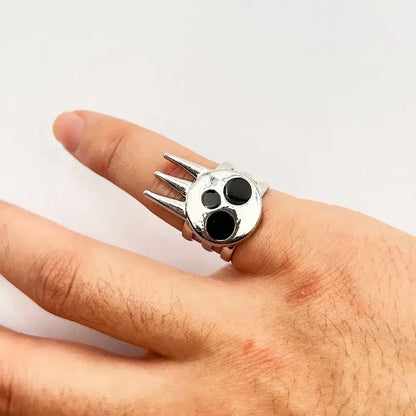 Silver soul eater kid skull ring with three black eyes and pointed metal spikes adjustable metal band