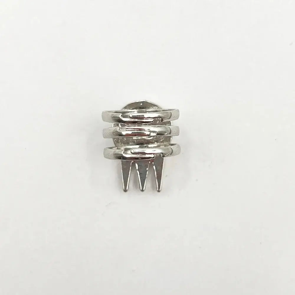 Silver-toned adjustable metal ring with stacked bands and prongs featuring soul eater kid skull design
