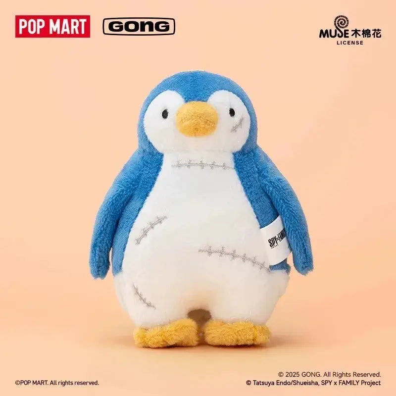 Blue and white plush penguin with yellow beak and feet featuring stitched patchwork design in spy x family anya blind box collectible