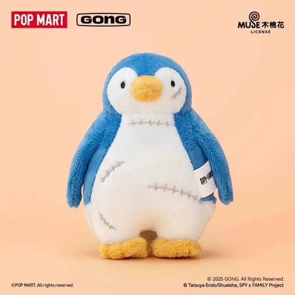 Blue and white plush penguin with yellow beak and feet featuring stitched patchwork design in spy x family anya blind box collectible