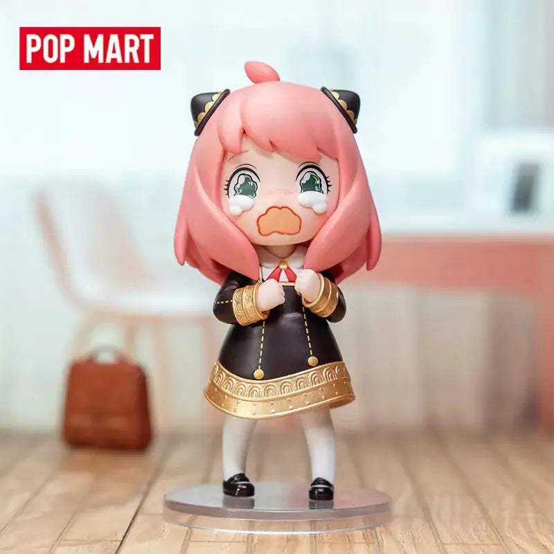 Pink-haired tearful spy x family anya blind box figure in black and gold outfit desktop collectible from pop mart