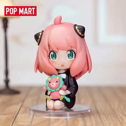 Pink-haired spy x family anya blind box chibi figure with black cat ears holding pink lion plush toy desktop collectible