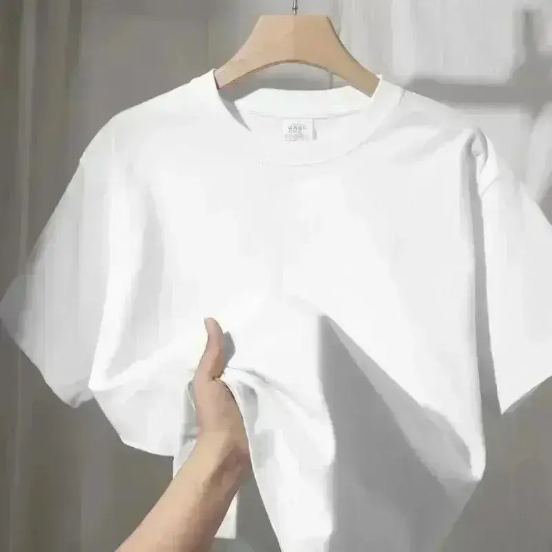 A crisp white cotton spy x family anya forger graphic tee with classic crew neck hanging on a wooden hanger