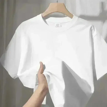 A crisp white cotton spy x family anya forger graphic tee with classic crew neck hanging on a wooden hanger