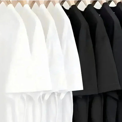 A row of minimalist white and black short-sleeved spy x family anya forger graphic tees on wooden hangers