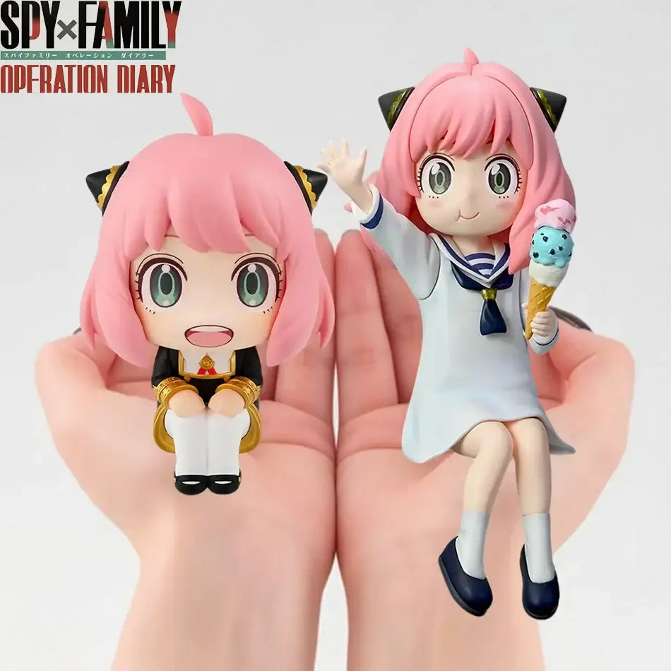 Two pink-haired spy x family anya forger pvc figures in black gold uniform with cat ears and white sailor dress holding ice cream