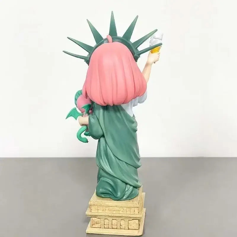 Spy x family anya forger pvc statue in statue of liberty style with pink hair green crown robe and dragon on shoulder
